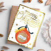 Christmas card with decorative ornament and 'Merry Christmas' text on a white background.