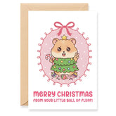 Christmas card with a cartoon bear in a Christmas tree costume and pink bow, with 'Merry Christmas from your little ball of fluff!' text.