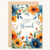 Personalized birthday card with blue and orange watercolor flowers and custom name in elegant script