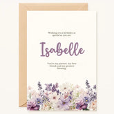 Celebrate your loved one’s birthday with a card as unique as they are. This premium greeting card showcases a delicate bouquet of watercolor flowers in gentle lavender, blush, and cream tones, elegantly framing your chosen name in a modern script font. The front reads: