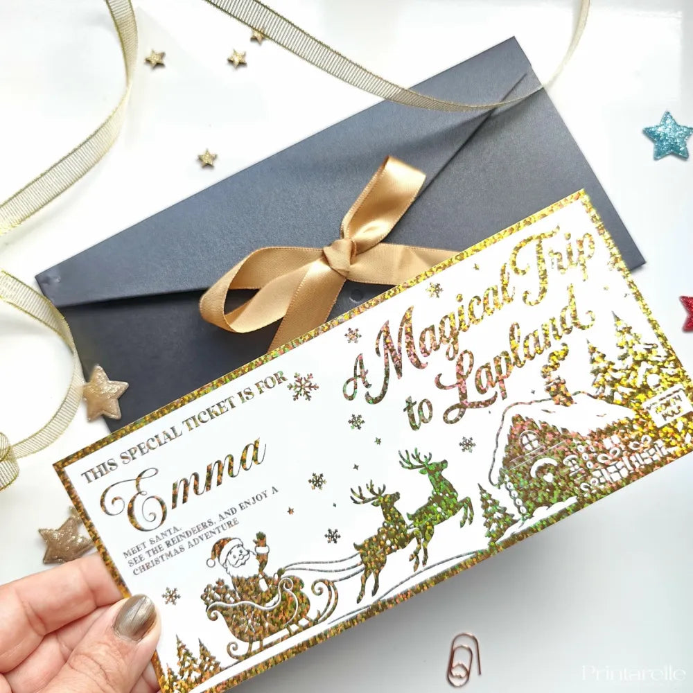 A festive gold and green foil keepsake ticket for a magical trip to lapland in a kraft envelope with santa sleigh design