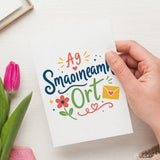 A white irish thinking greeting card with colorful lettering and illustrated design reading smaoineamh ort