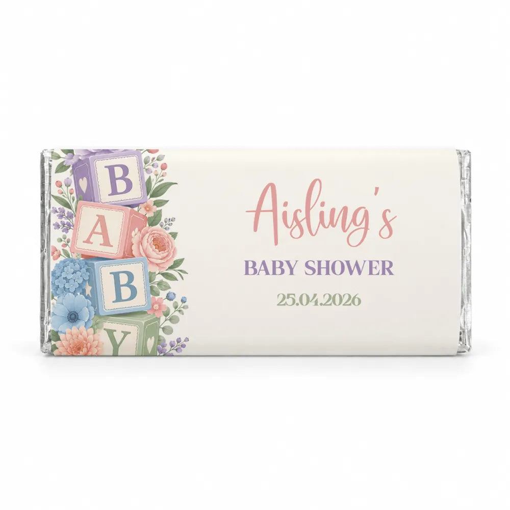 Personalized baby shower chocolate bars wrapped in silver foil with pastel floral and alphabet blocks shower design