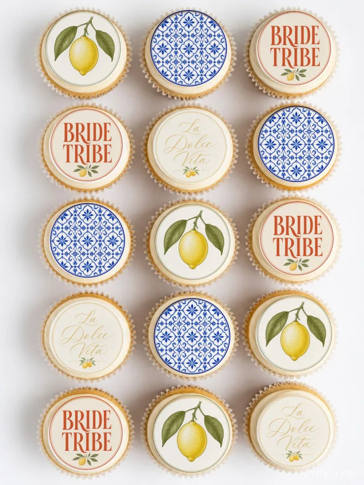 Decorative white frosted dolce vita hen party cupcake toppers with lemon designs and orange bride tribe text