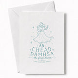 A white wedding card with teal line art of a dancing couple and text an chéad damhsa for wedding day cards