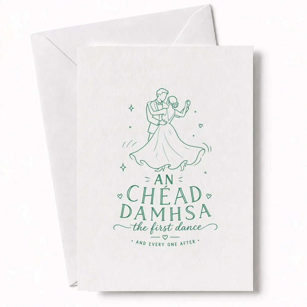 A white wedding card with a delicate green line drawing of a couple dancing and the text an chéad damhsa the first dance for your wedding day cards