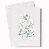 A white wedding card with a delicate green line drawing of a couple dancing and the text an chéad damhsa the first dance for your wedding day cards
