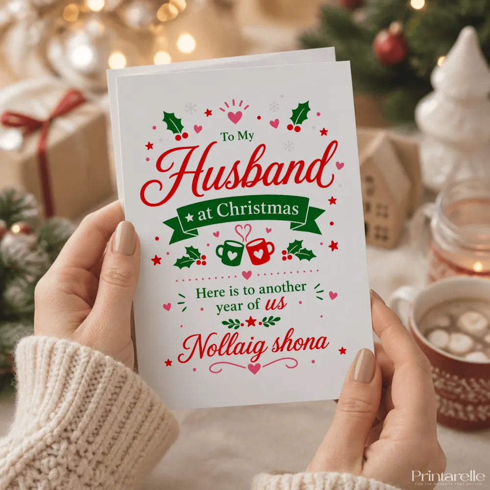 A white husband christmas card with red and green designs saying to my husband at christmas nollaig shona with white envelope