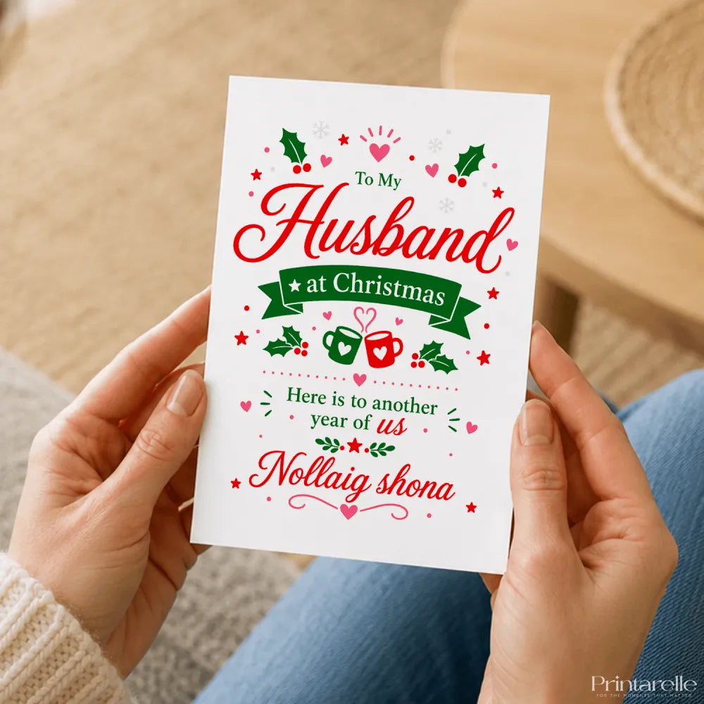 A festive white husband christmas card with red green holiday illustrations and message to my husband at christmas in white envelope