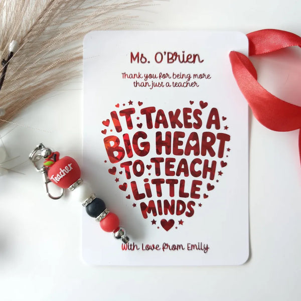 Red beaded keychain with a red heart charm engraved with teacher and silver accents for personalised teacher card gifts