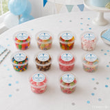 Clear plastic tubs of colorful gummy candies sealed with white labels featuring a blessed cross for cross confirmation