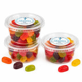 Clear plastic containers of colorful translucent gummy candies shaped like animals for blessed cross confirmation