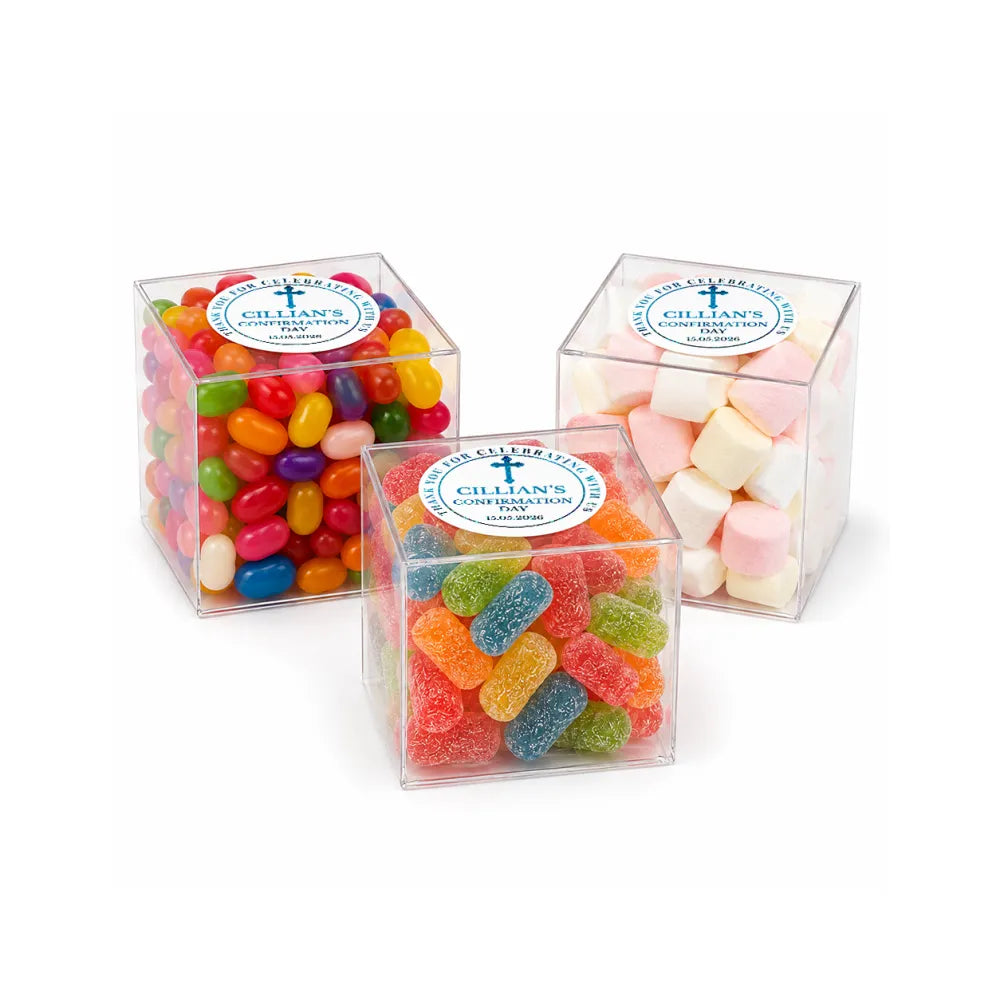 Clear acrylic box filled with colorful jelly beans gummy worms and marshmallows for blessed cross confirmation gift
