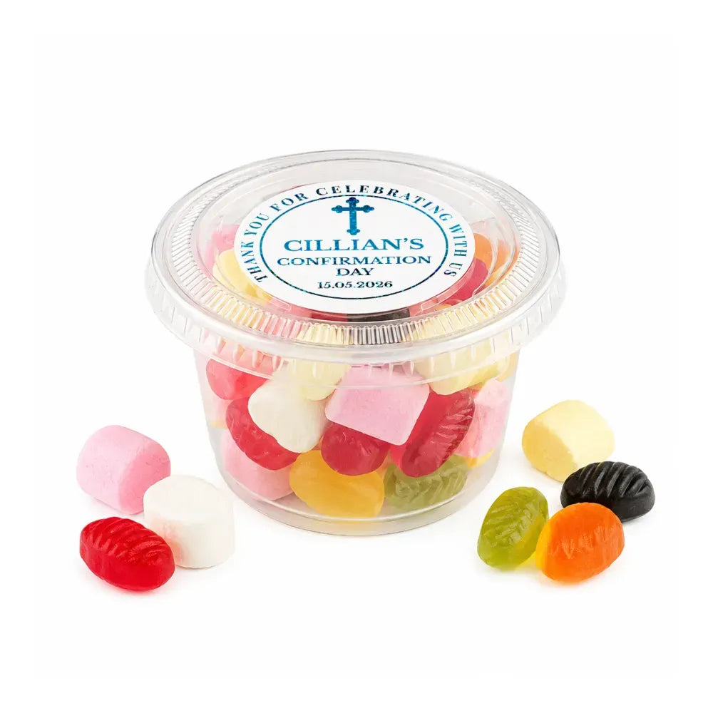 A clear plastic tub of colorful heart-shaped and oval gummy candies with a blessed cross confirmation foil sticker