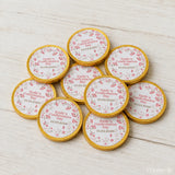 Gold-wrapped 40mm milk chocolate coins with pink floral designs and personalized emilys confirmation day text