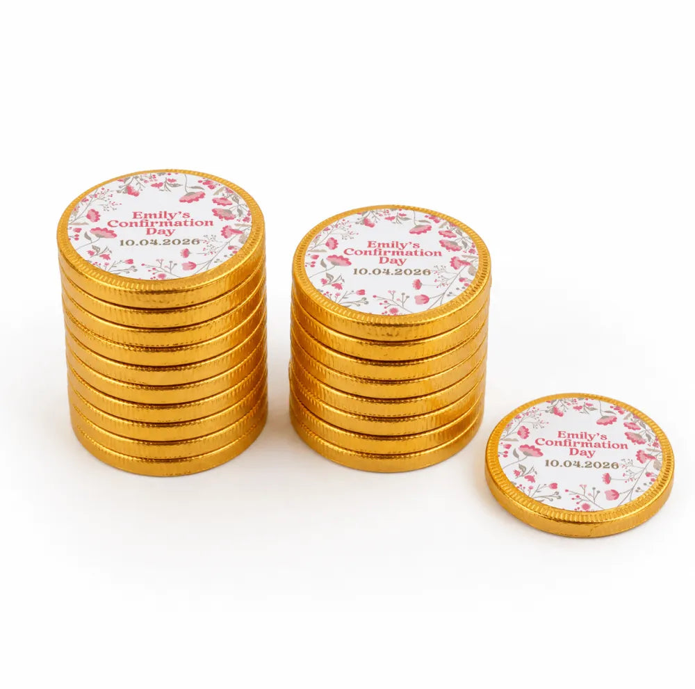 Golden 40mm milk chocolate coins with pink floral designs and personalized emilys confirmation day labels stacked in two piles