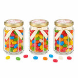 Three clear glass hex jars with 48mm pale gold lids and personalised sticker printed filled with colorful jelly beans