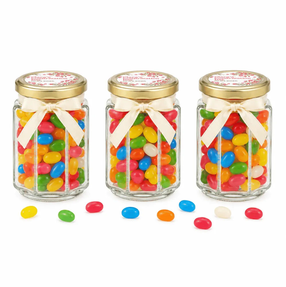 Three clear glass hex jars with 48mm pale gold lids and personalised sticker printed filled with colorful jelly beans
