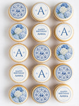 Blue and white chinoiserie birthday cupcake toppers with floral pattern and decorative a initials for cakes
