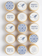 Blue and white hen party cupcake toppers with elegant patterned bride squad and monogrammed designs