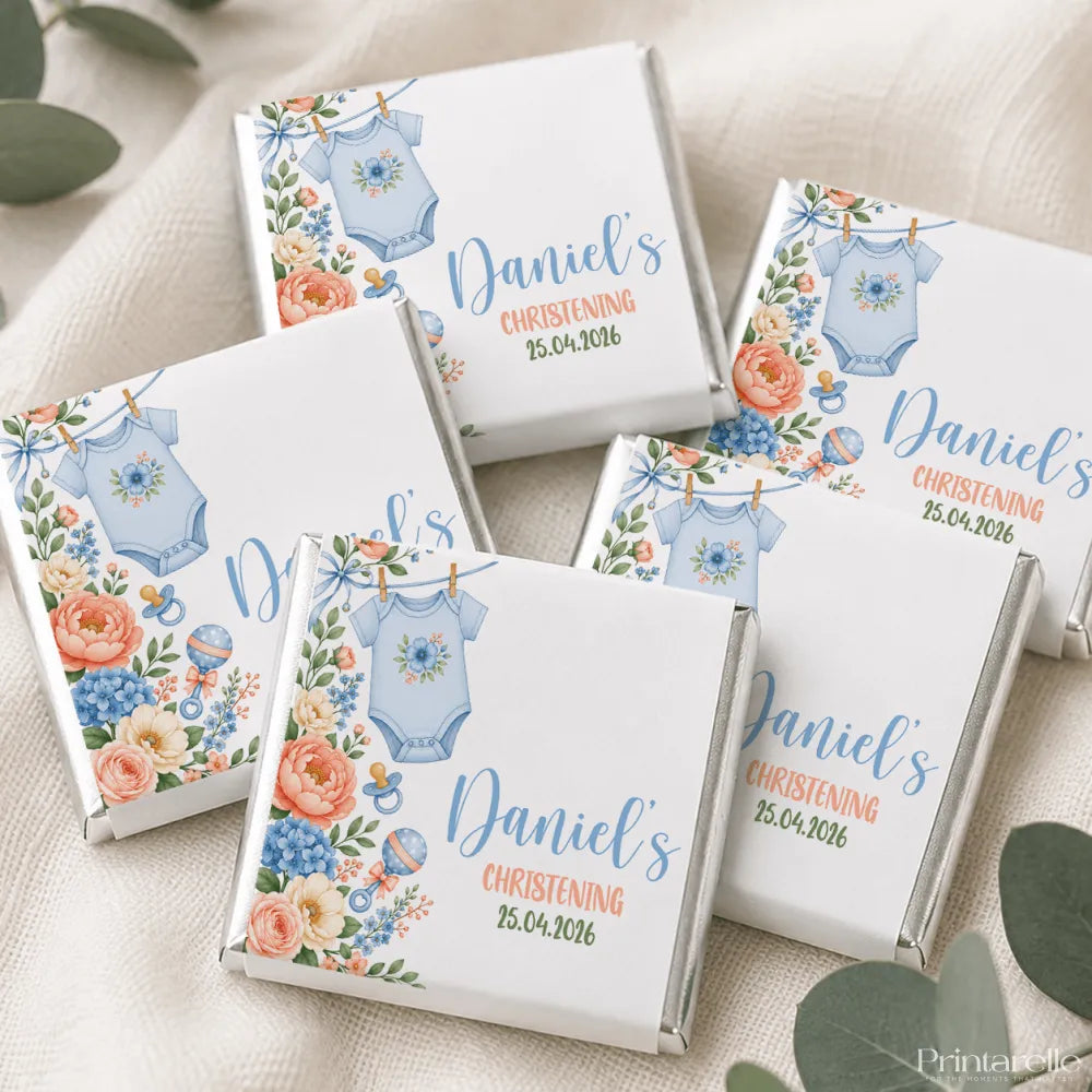 White chocolate mini neapolitan chocolates box with blue baby onesie and floral design personalized for daniels christening