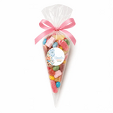 A clear cellophane sweet cone filled with colorful gummies tied with pink ribbon and blue onesie themed label