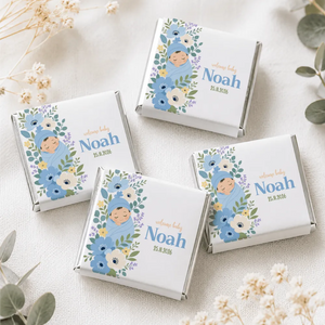 White chocolate mini neapolitan chocolates with blue green floral wrapper featuring sleeping baby noah and date