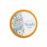 Circular gold-edged milk chocolate coins with blue swaddle baby and welcome baby noah 25.11.2026 design