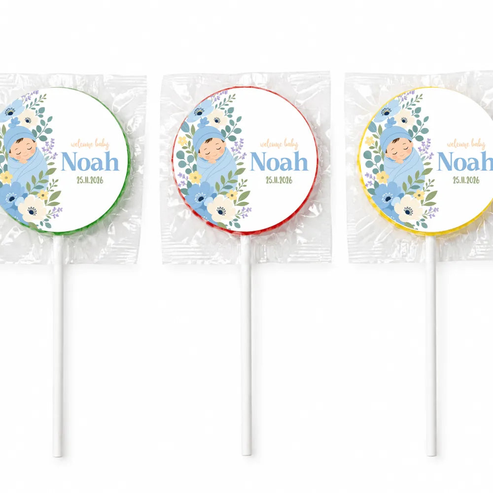 Three blue swaddle lollipop favours with personalized baby noah illustration and arrival date on white labels