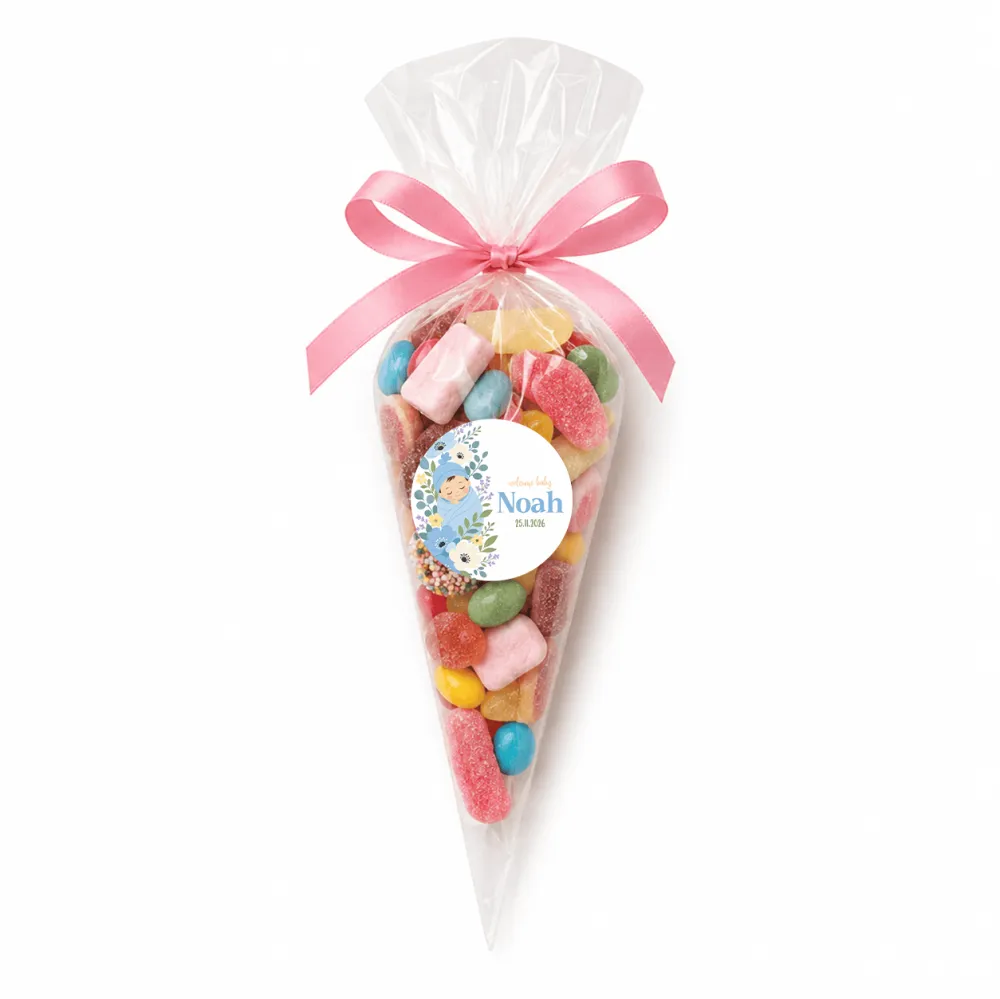A clear plastic sweet cone filled with colorful gummies tied with pink satin ribbon and blue swaddle label noah
