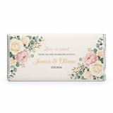 A personalised 40g chocolate bar with blush peony floral design in pink cream and gold on an off-white wrapper