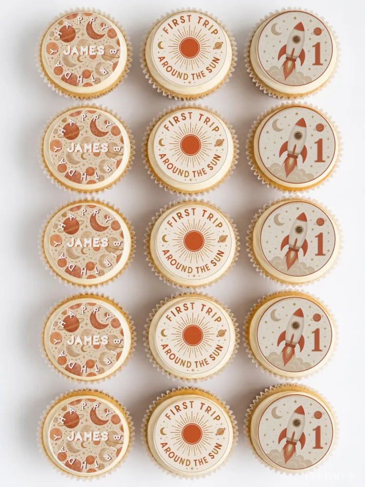 Boho space birthday cupcake toppers in terracotta and cream with space designs and names like james first trip around the sun
