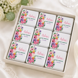 Pink and purple floral themed mini neapolitan chocolates in a white box for baby shower gift Bottle and Bloom Shower