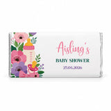 A white wrapped 40g chocolate bar with pink purple flowers baby bottle and pacifier for baby shower gifts
