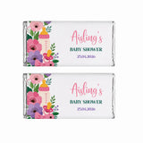 Two personalized 40g silver foil chocolate bars with pink purple floral baby bottle designs for baby shower gifts