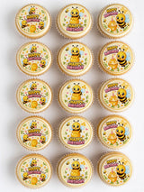 Cute yellow and black bumble bee birthday cupcake edible toppers with pink text on white icing sheet background