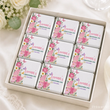 White gift box with pink floral and baby carriage themed mini neapolitan chocolates for christening celebration