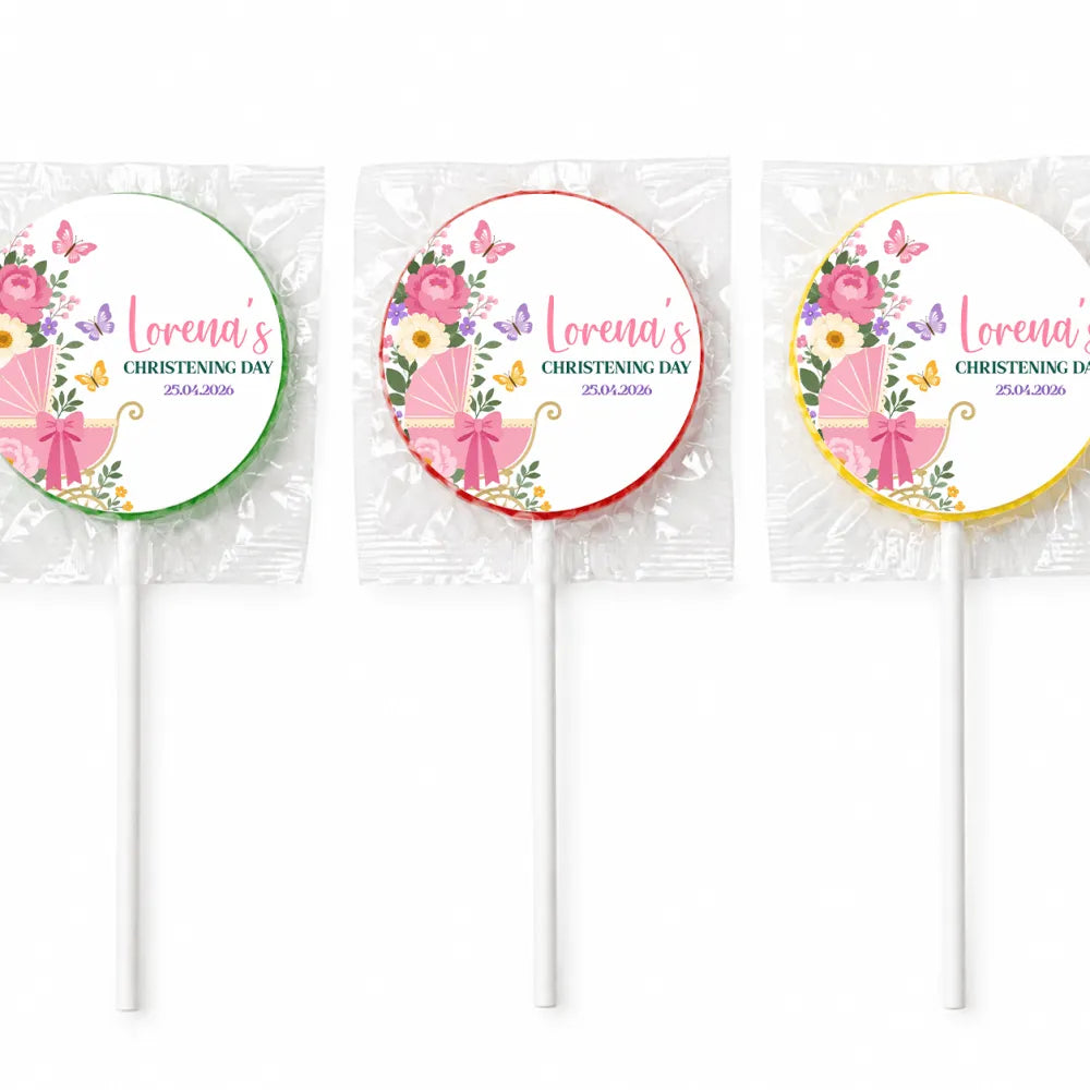 Three personalized pink swirl lollipop favours wrapped in cellophane for butterfly pram christening favors