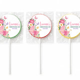 Three personalized pink swirl lollipop favours wrapped in cellophane for butterfly pram christening favors