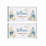 Two personalised 40g white chocolate bars wrapped in silver foil with blue and cream floral candle and shell design