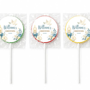Three personalized round christening lollipop favours with blue floral design gold text and candle shell decorations wrapped in cellophane