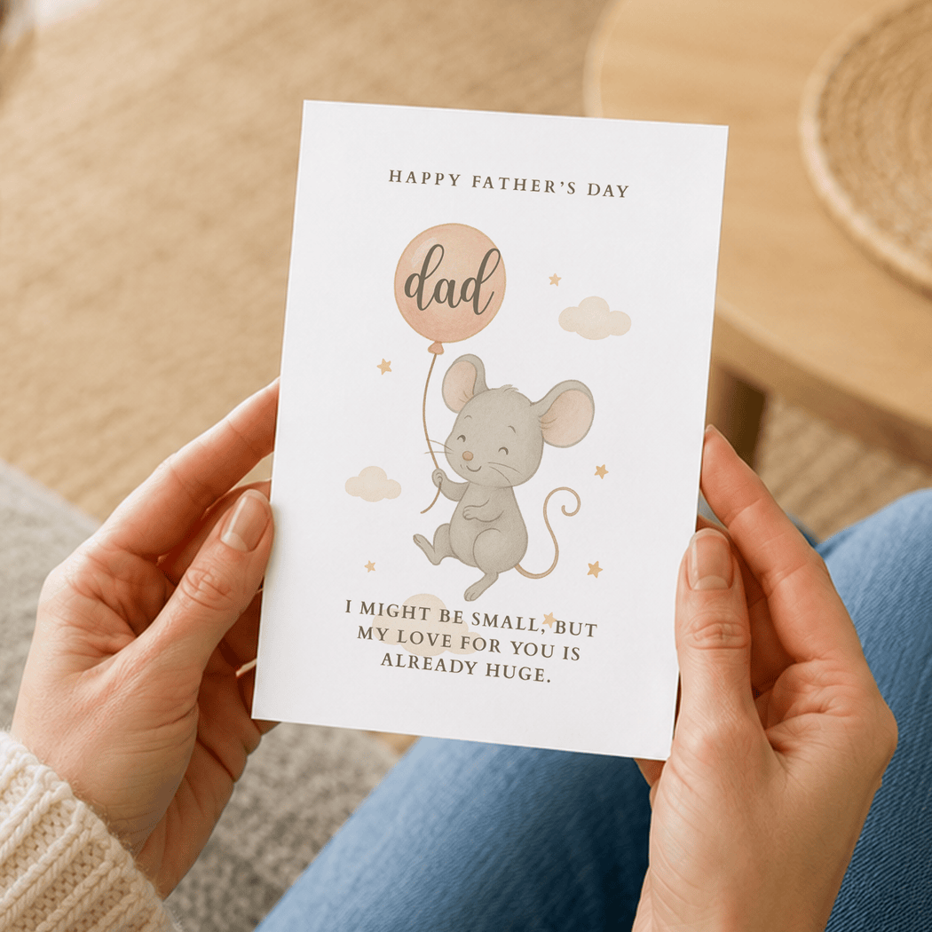 Person holding a Father's Day card with a mouse illustration and text.