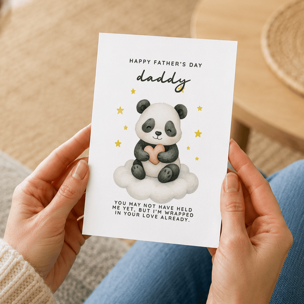 Person holding a Father's Day card with a panda illustration and text.
