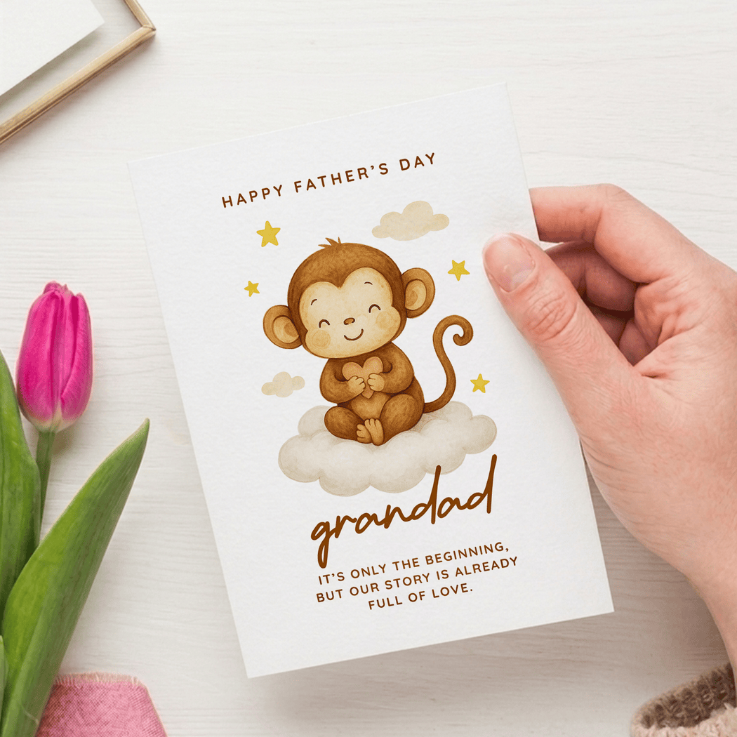 Hand holding a Father's Day card with a monkey illustration and text, next to a pink tulip.