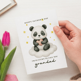 Hand holding a Father's Day card with a panda illustration and pink tulip on a white background