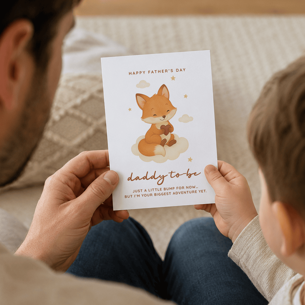 Person holding a Father's Day card with a fox illustration to another person.