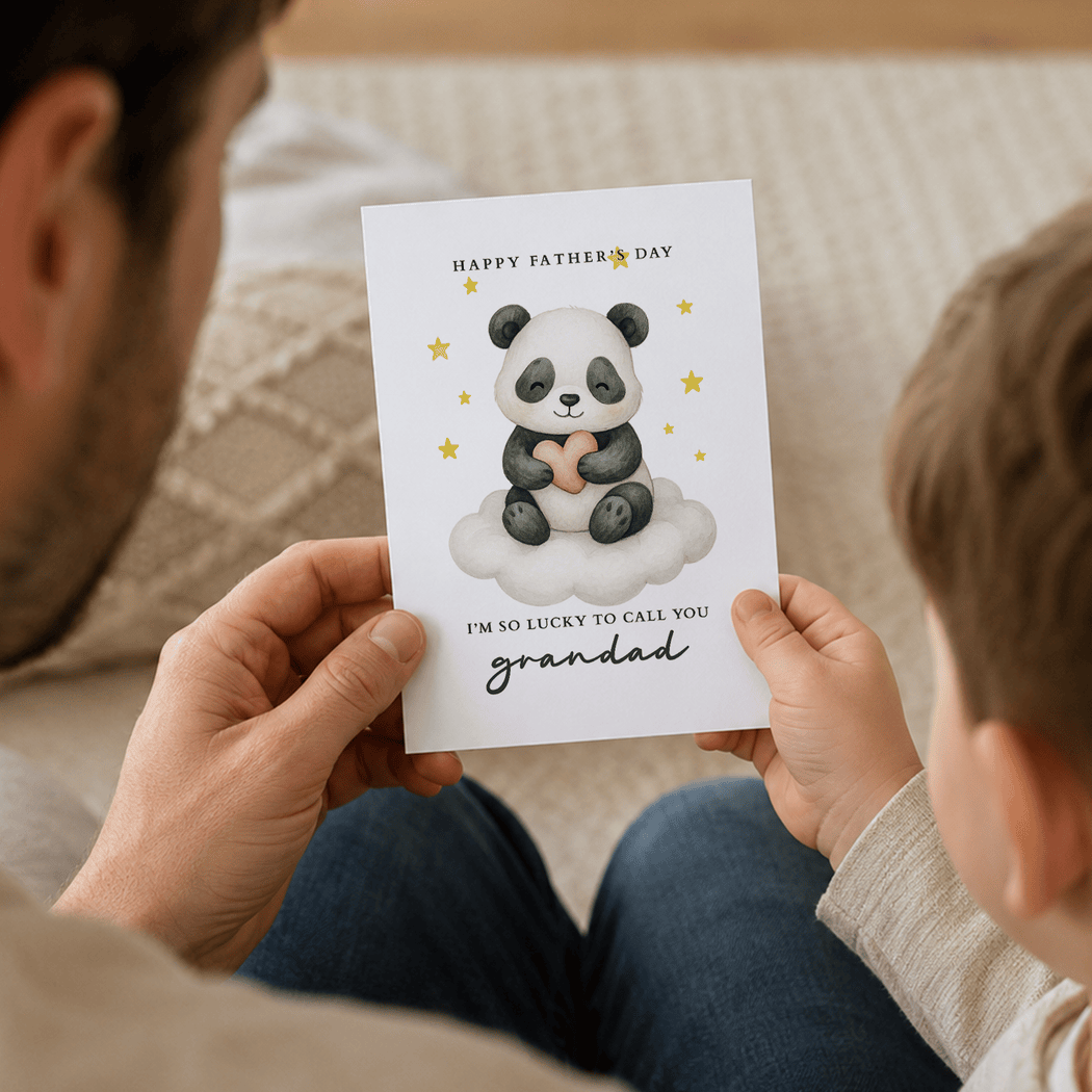 Person holding a Father's Day card with a panda design and text.