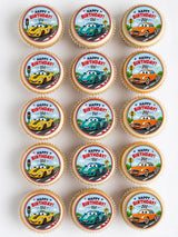 Colorful cartoon racing cars birthday cupcake toppers on circular icing sheet with happy birthday text for cupcakes