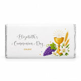 White chocolate bar wrapped in silver foil featuring golden chalice with grapes and lilies on personalised 40g chocolate bar