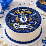 Blue and white frosted edible cake with chelsea fc edible cake topper featuring emblem flags and william banner